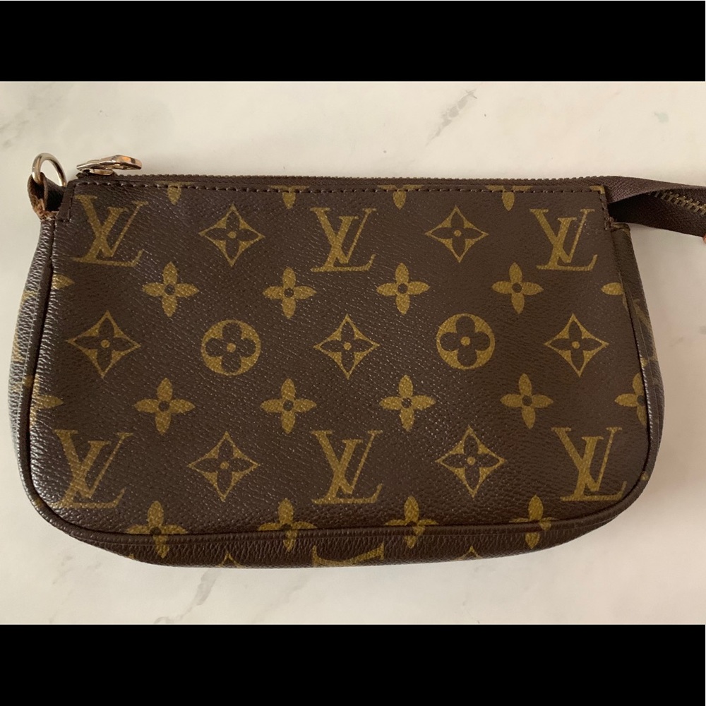 LV clutch **price reflects authenticity**